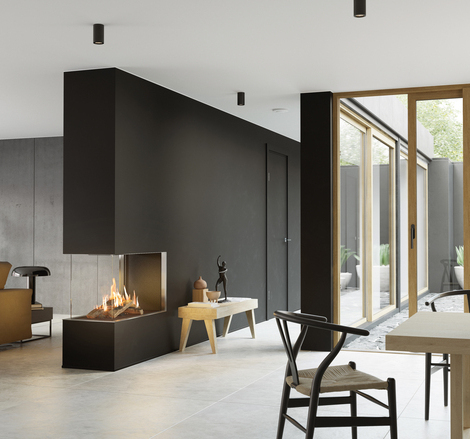 VISIO 90 RD GAS Gas-Kamin VISIO 90 RD passt als Raumteiler in einer schwarzen Wand ideal zwischen Wohnzimmer und Esszimmer und strukturiert den schlicht dekorierten Wohnraum