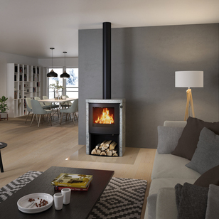 Poêle à bois Q-TEE 2 C pierre ollaire avec porte en acier et compartiment à bois dans la maison d'habitation en différents tons de gris
